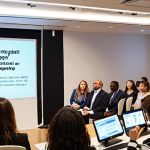 **Image Prompt: Intellectual Property Workshop**
   - "A diverse group of professionals engaged in a workshop on intellectual property, featuring a speaker at the front discussing patents and trademarks. The audience is taking notes and participating actively, with visuals of patents and trademarks displayed on a screen."